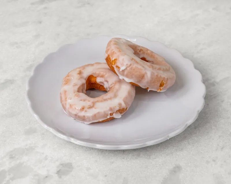 Two glazed old fashioned donuts