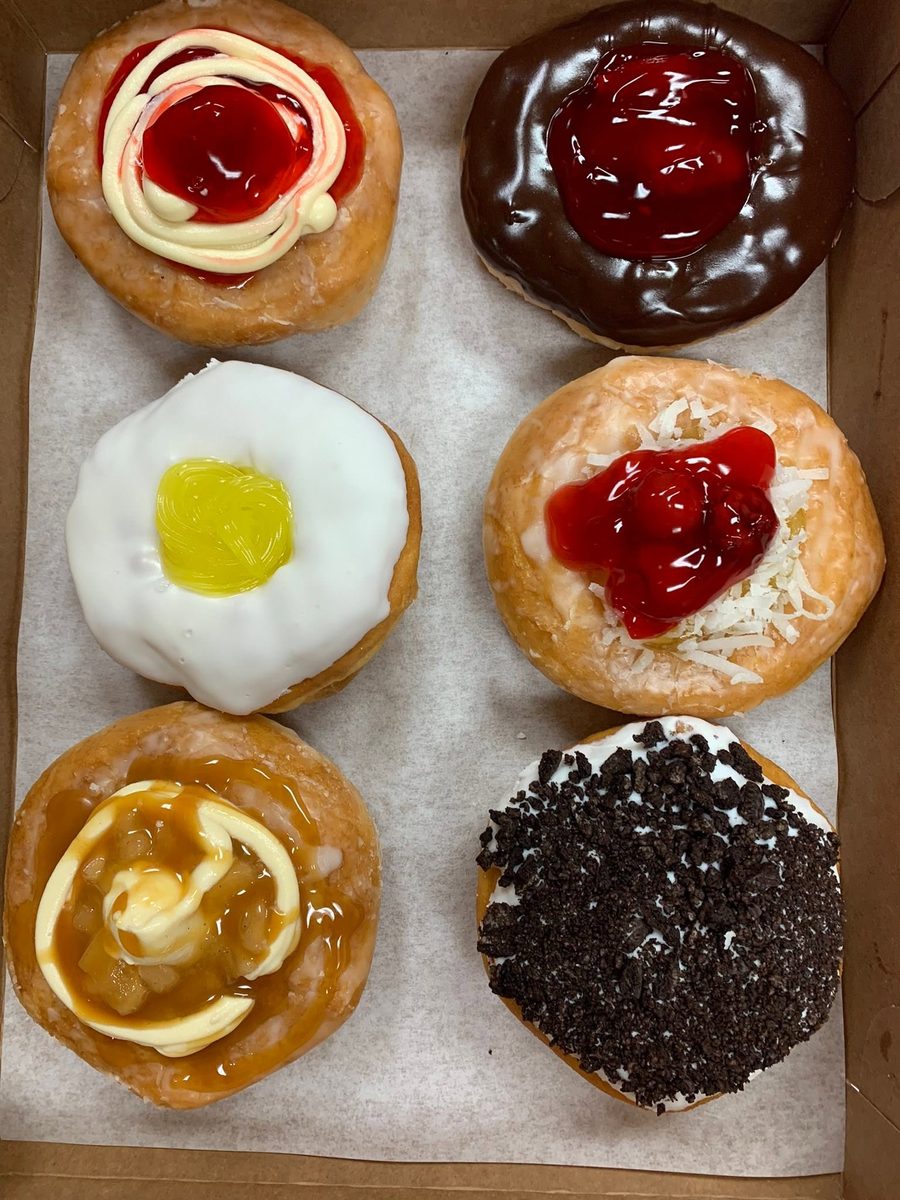 Box of specialty filled donuts including cherry, Bavarian cream, lemon and coconut